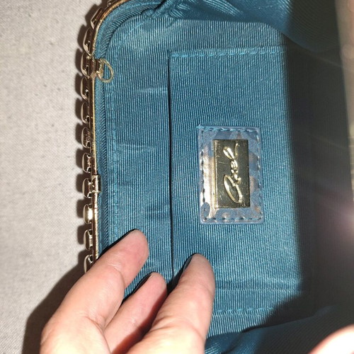 Axel small crossbody bag like new with detachable chain and embossed design