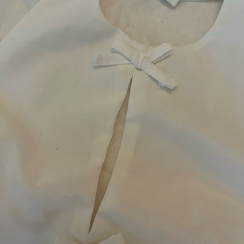 White sleeveless top with bows size S like new