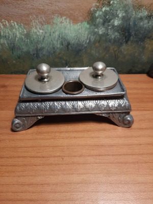 Antique inkstand with two ink wells and decorative motifs, used