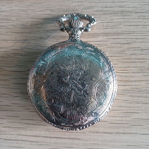 Old pocket watch like new with embossed pattern
