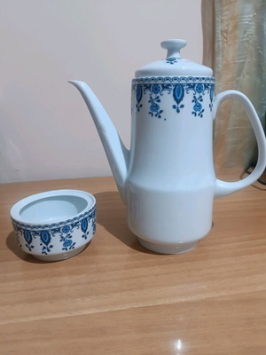 Vintage porcelain coffee pot and sugar bowl used with blue design