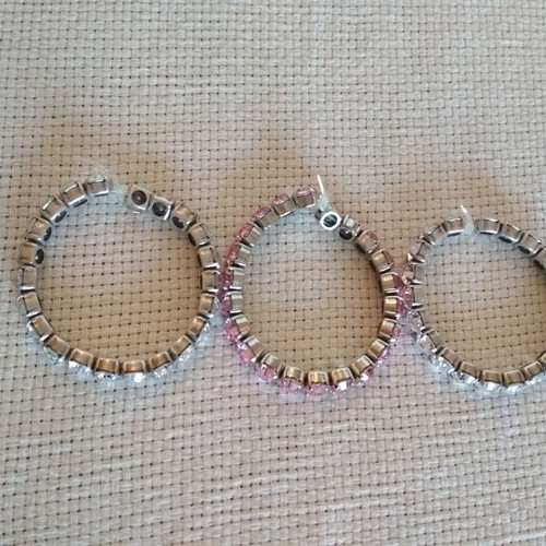 Set of three tennis bracelets like new, pink and white