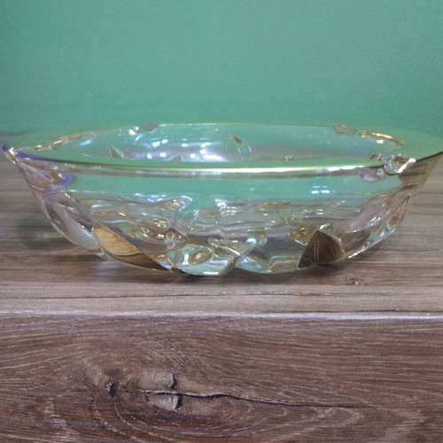 Crystal ashtray used, heavy with embossed gold-plated designs