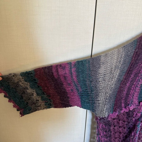 Knitted cardigan like new, multicolored with two patterns