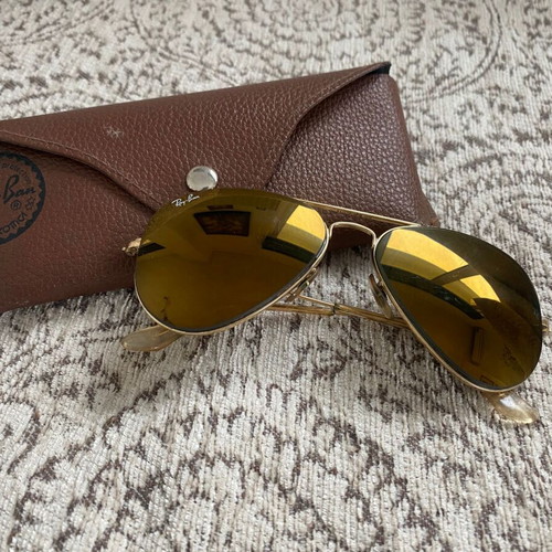 Ray-Ban sunglasses used with double gold-mirror lens