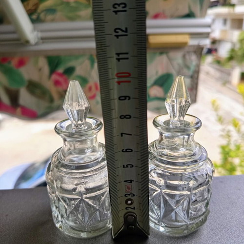 Vintage glass miniature bottle set of 2 with carved pattern and glass stopper