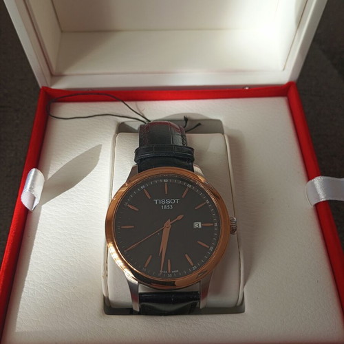 Tissot Classic Gent watch with 18k gold bezel, quartz, new