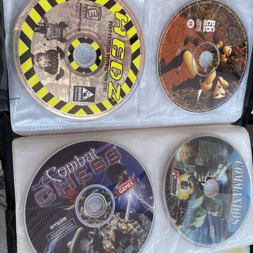 Vintage PC and PlayStation 2 gaming bundle with case, 70 CDs/DVDs