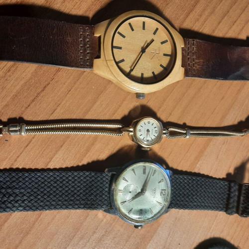 Two vintage wind-up watches and one bamboo watch used