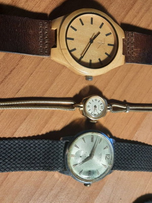Two vintage wind-up watches and one bamboo watch used