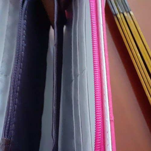 Pink wallet used with white bow