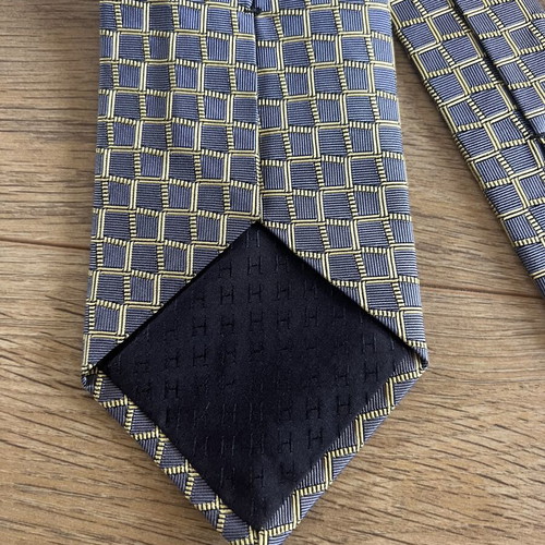 Hermes silk tie like new with geometric basketweave pattern in blue and yellow