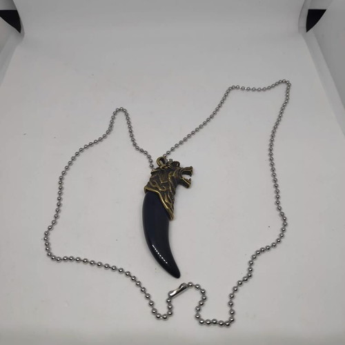 Necklace with wolf tooth pendant like new, gold and black