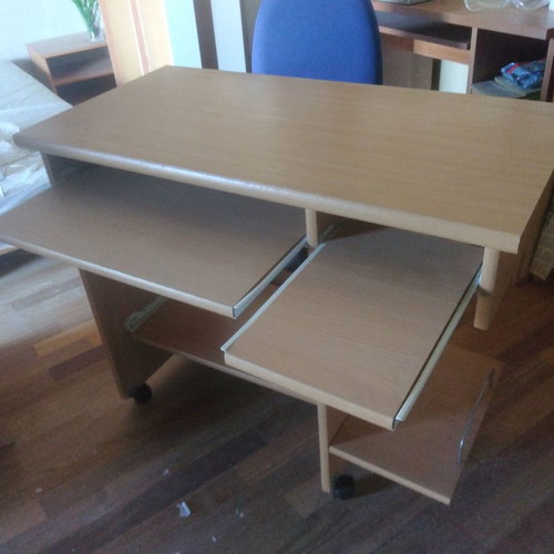 Computer desk with used office chair and wheels