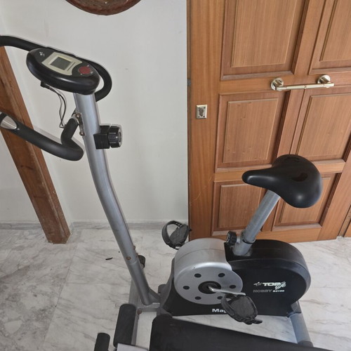 Stationary bike and incline abdominal bench used, good condition
