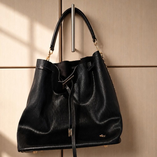 Mitu black bucket bag like new, faux leather with gold details
