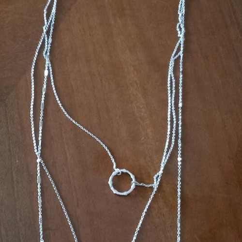Necklace new with 3 chains and 1 clasp in silver color