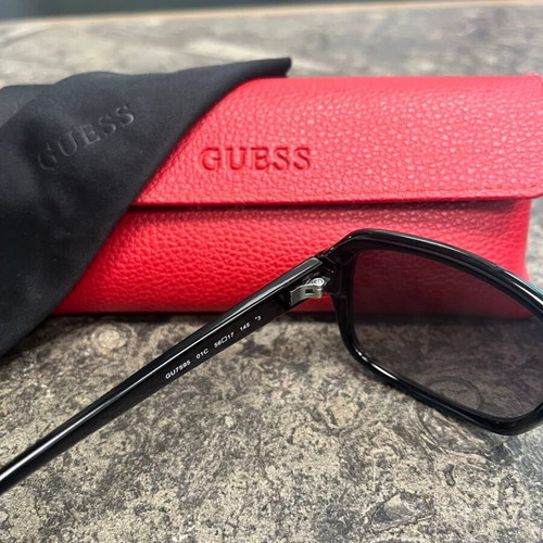 Guess women's sunglasses with red protective case and black cloth