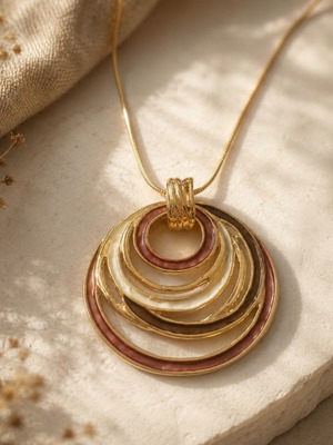 Golden Orbit statement necklace with circular pendant