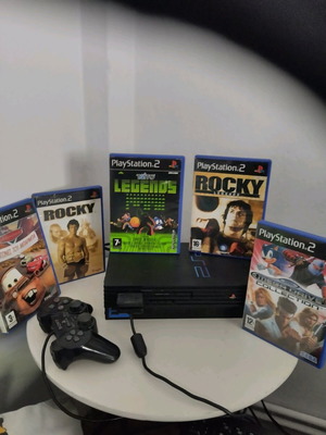 PlayStation 2 used with games, controller, and memory card