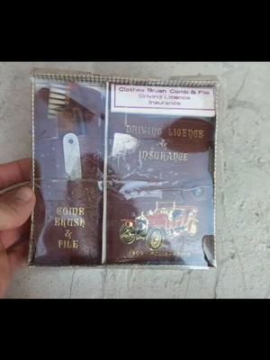 Vintage driving licence with comb and brush set used