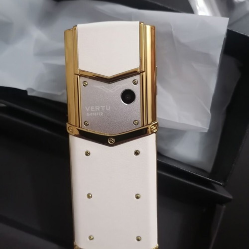 Vertu phone new, gold with metal leather body and dual card slot