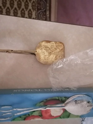 Vintage serving tongs new with embossed design