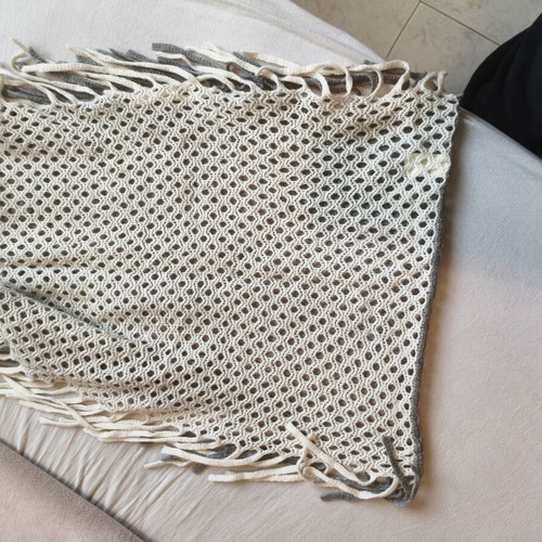 Knitted scarf used with boho style in gray and cream