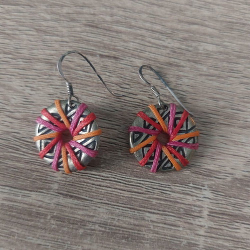 Silver earrings with multicolored waxed thread used