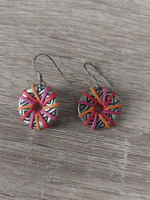 Silver earrings with multicolored waxed thread used