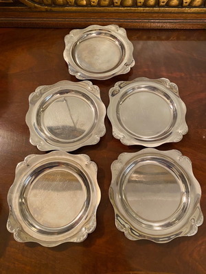 Set of 5 metal small plates and 6 matching stainless steel bowls used