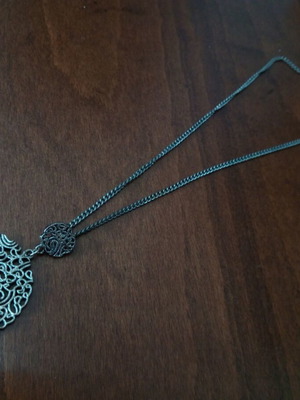 Metal pendant with pierced design used, silver color