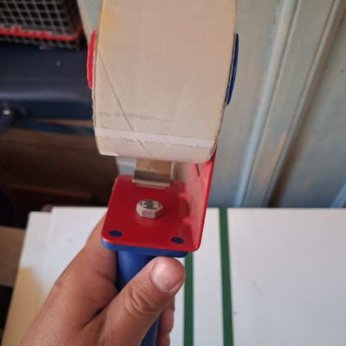 Packing tape gun used with roll included