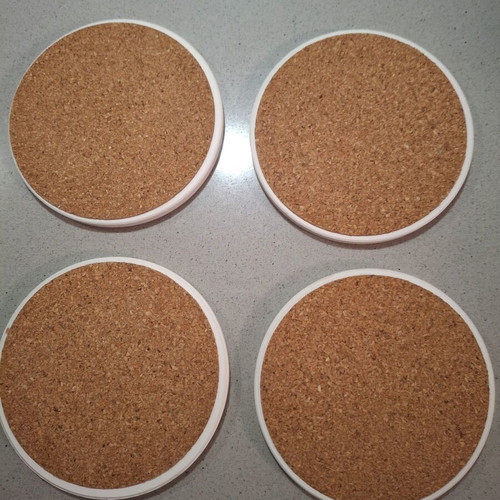 Set of 4 collectible ceramic coasters like new, 10cm diameter