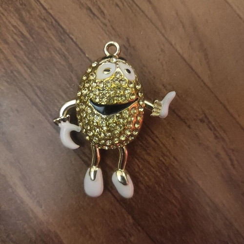 The Smiling Child pendant necklace like new, gold with white enamel
