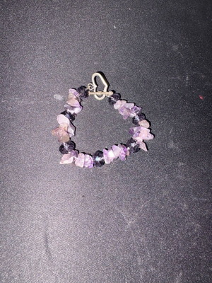 Bracelet like new with decorative black and pink stones