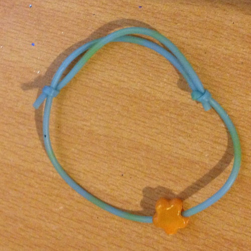 Turquoise bracelet with orange flower bead used