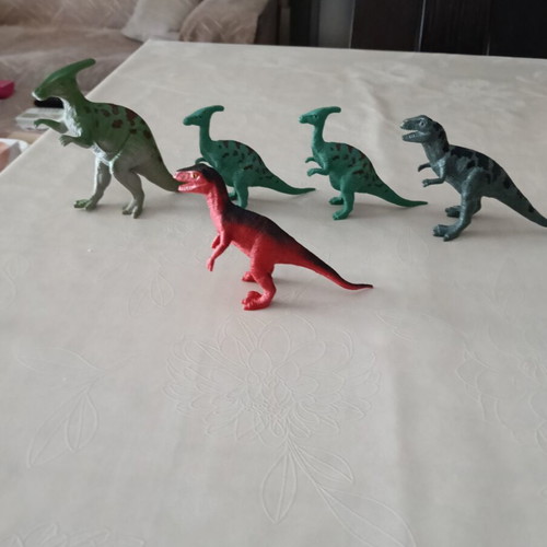 Set of 24 dinosaur figures in various sizes