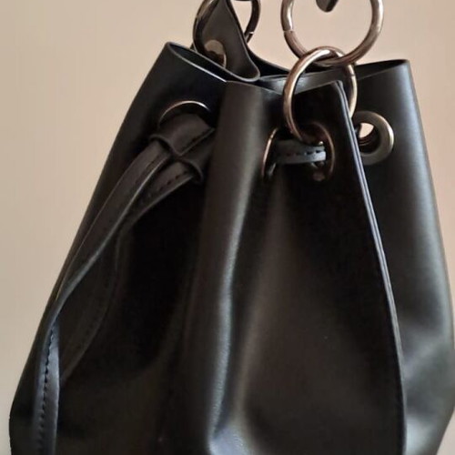 Pink Woman black bucket bag used, soft faux leather with metal details