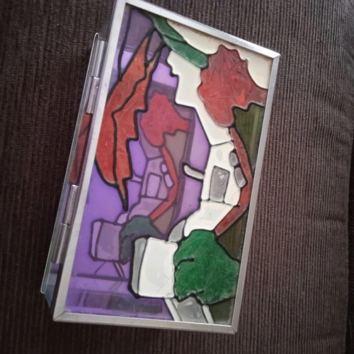 Stained glass jewelry box used with embossed colors and mirror base