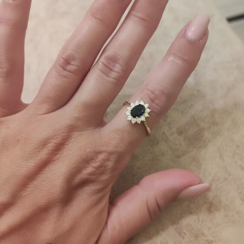 Women's rosetta ring new, gold color with blue oval stone and zircons