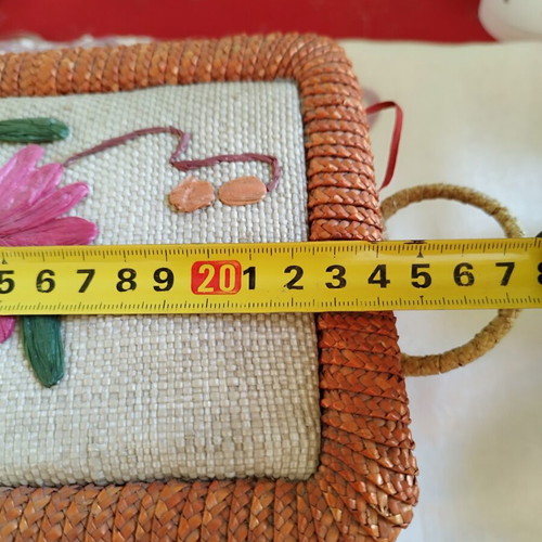 Vintage wicker sewing box with floral decoration used