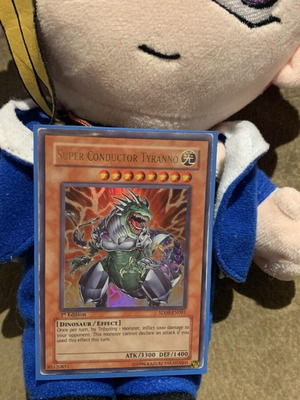Super Conductor Tyranno Yu-Gi-Oh card used with minor wear