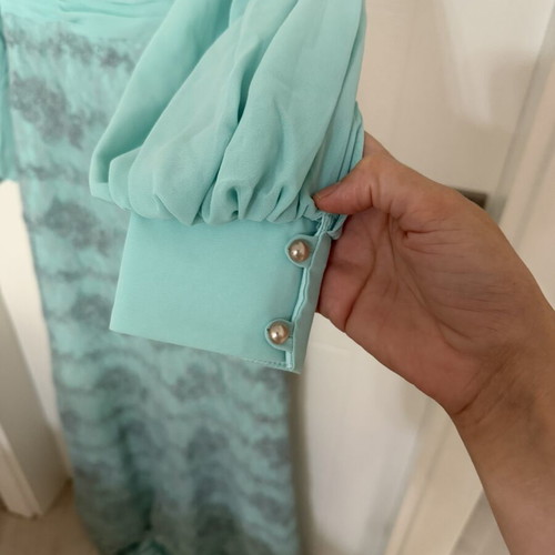 Long turquoise dress with lace embroidery and satin details