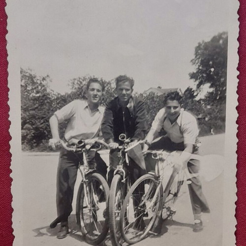 Vintage black and white photo of men with bicycles used