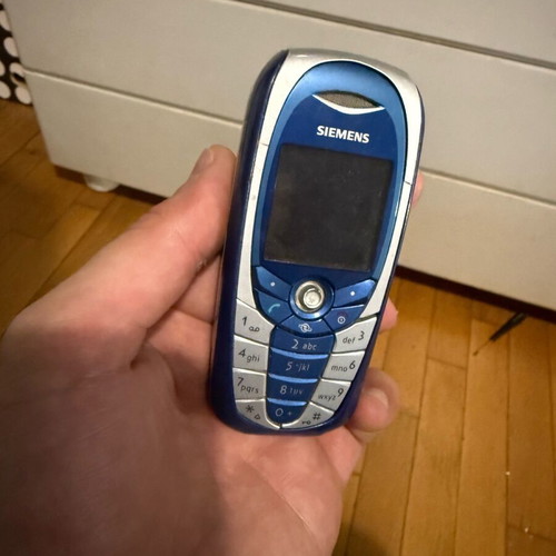 Siemens C65 mobile phone used, blue, keypad intact