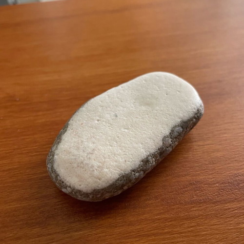 Natural limestone pebble new, smoothed from beach