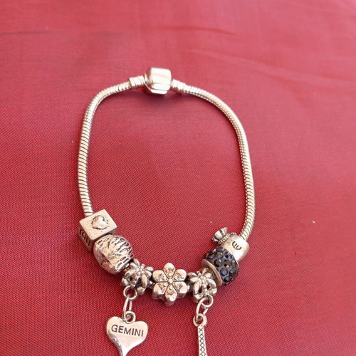 Steel bracelet with removable charms like new