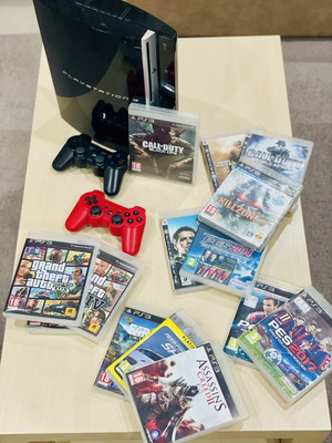 PlayStation 3 Fat 500GB console with 11 games, 2 controllers