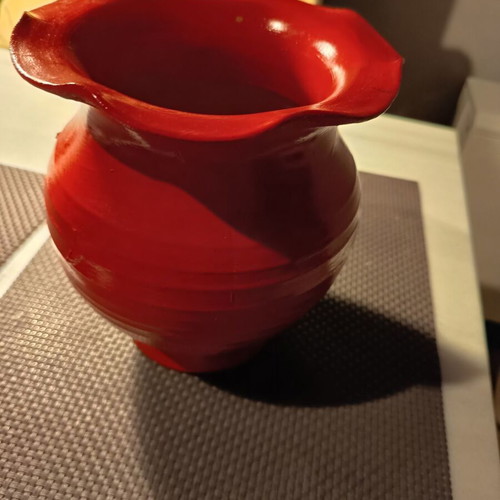 Handmade traditional clay vase with painted flowers